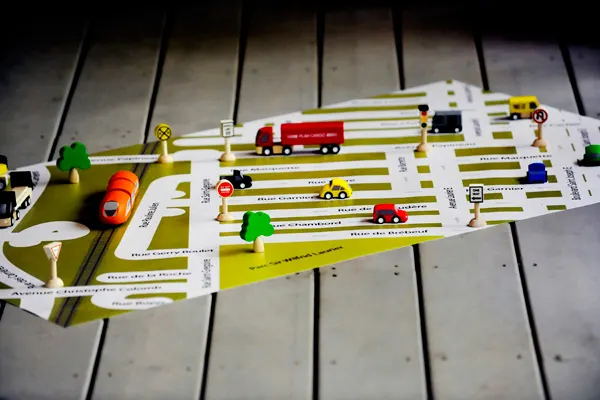Giant neighborhood play mats that will help kids get familiar with their local streets while riding their toy cars on these custom-designed road maps - at Non Toy Gifts