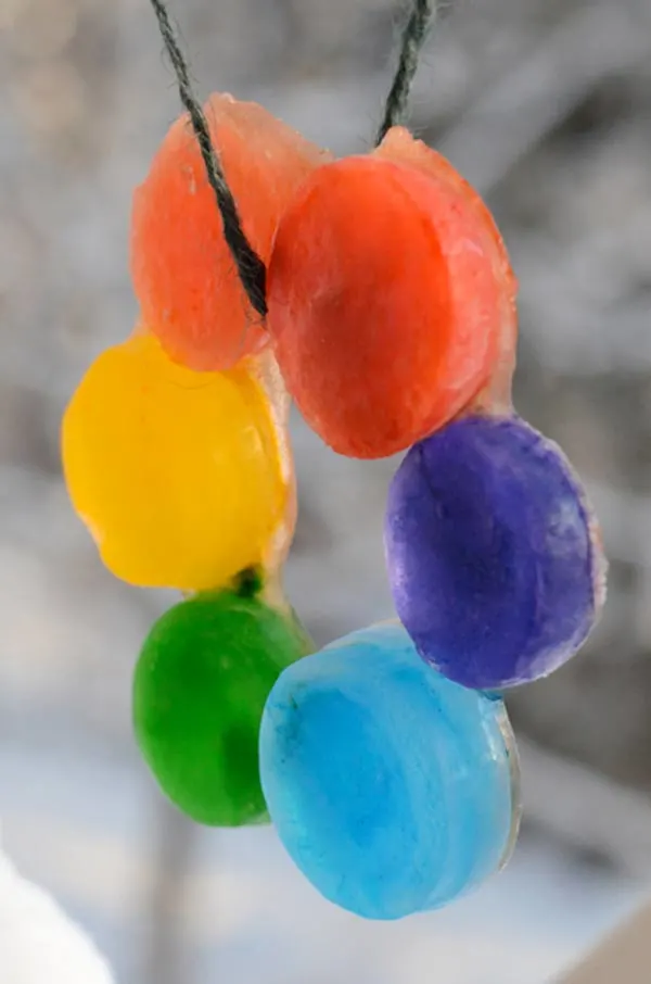 Make a rainbow ice ring - one of the 20 outdoor snow activities for kids. Be prepared for that snowy day when school is off and kids want to go outside and play. This list of snow and ice activities for kids of all ages is just what you need for any winter day. | at Non Toy Gifts