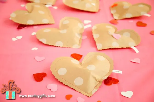 Simple DIY Valentine's Day treat bags to make from wrapping paper. Free printable. - at Non Toy Gifts