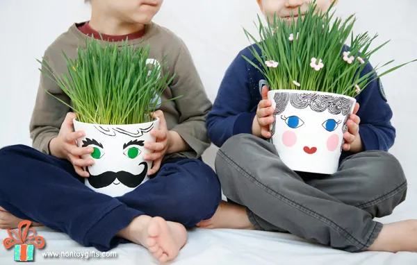 Grass head pots - a fun spring gardening craft for kids. Plant the seeds, water everyday and wait for the grass to grow. | at Non Toy Gifts