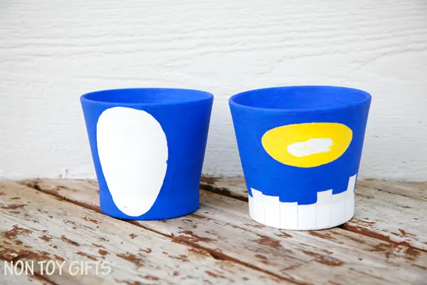 Superhero grass pots - fun craft for kids