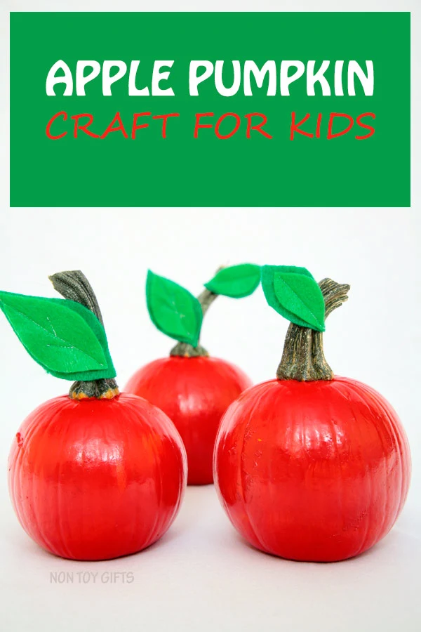 Easy apple pumpkin craft for kids. Perfect fall craft for toddlers or older kids. Paint small pumpkins red and glue a few green leaves. | at Non Toy Gifts