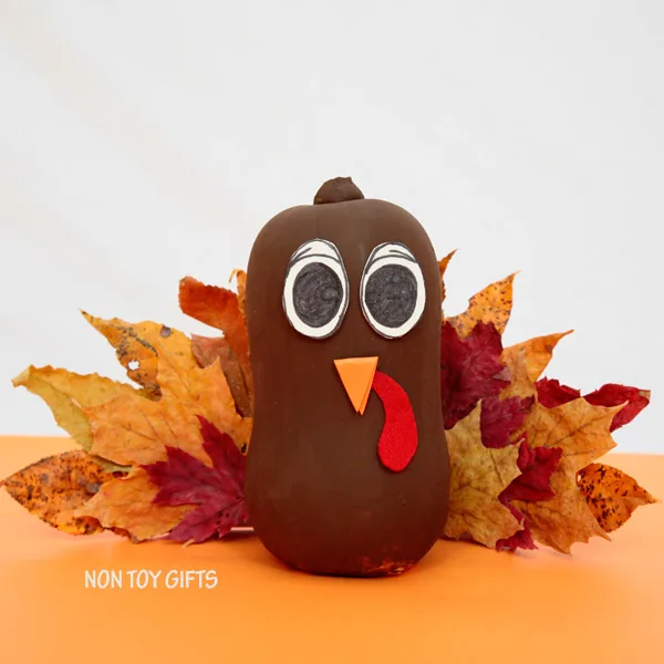 Easy Thanksgiving craft for kids. Make a turkey using a butternut and autumn leaves. | at Non-Toy Gifts