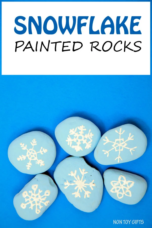 Snowflake painted stones for kids to play with. Winter craft. | at Non Toy Gifts