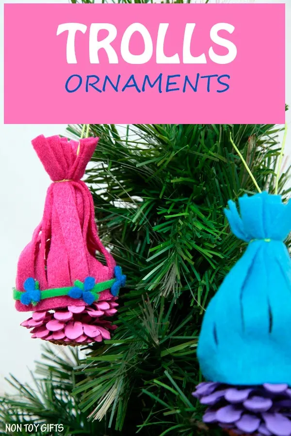 Trolls ornaments made from pine cones and inspired by Princess Poppy and Creek. Make these colorful ornaments for your Christmas tree. Adorable Trolls craft for kids. | at Non Toy Gifts