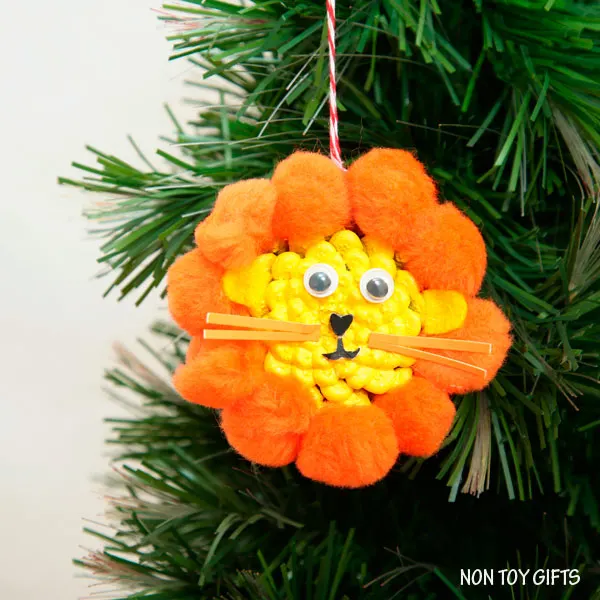 DIY pine cone lion ornament. Fun winter craft for kids. | at Non-Toy Gifts