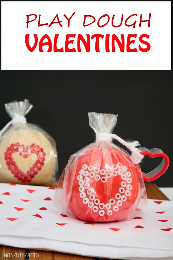 These play dough Valentines make great Valentine non-candy treats for preschool and kindergartner classroom party. Fun Valentine's Day activity for kids. Use heart shaped cookie cutter and decorate with beads | at Non-Toy Gifts