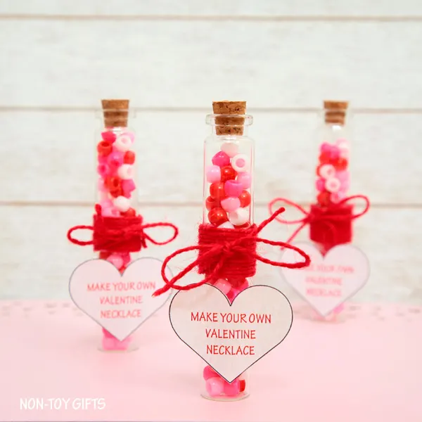 Make Your Own Valentine Necklace is a sweet and simple DIY Valentine favor that you can make for your kid's friends and classmates.