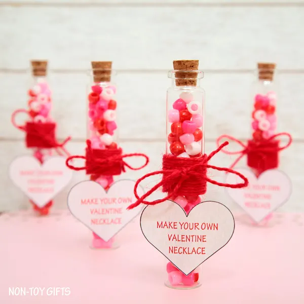 Make Your Own Valentine Necklace is a sweet and simple DIY Valentine favor that you can make for your kid's friends and classmates.