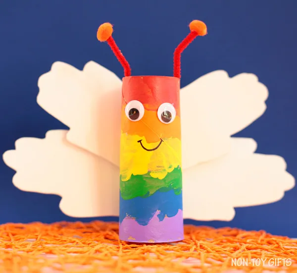 Paper roll rainbow handprint butterfly craft for kids. Perfect spring craft or St. Patrick's Day craft. Easy for toddlers to make. | at Non-Toy Gifts
