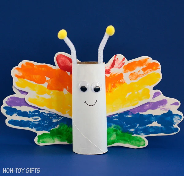 Paper roll rainbow handprint butterfly craft for kids. Perfect spring craft or St. Patrick's Day craft. Easy for toddlers to make. | at Non-Toy Gifts