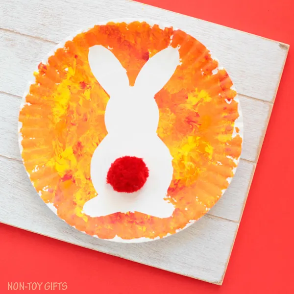 Paper plate Easter bunny craft for kids. Easy art project for toddlers, preschoolers, kindergartners and older kids to use as decoration for Easter. Easy spring rabbit craft. | at Non-Toy Gifts