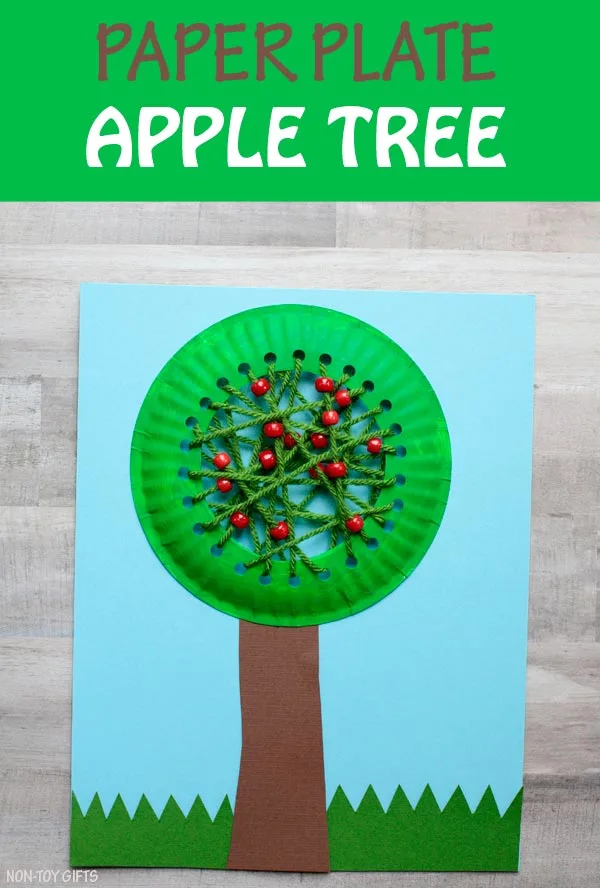 Paper plate apple tree craft for kids to try this fall. Learning about apples? Craft this fall tree with yarn and pony beads. | at Non-Toy Gifts