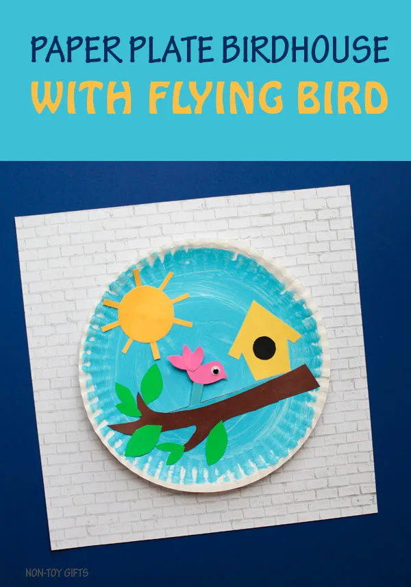 Paper plate birdhouse craft for kids. It has a flying bird glued on a stick that kids can move along the tree branch. Fun spring or summer craft. | at Non-Toy Gifts