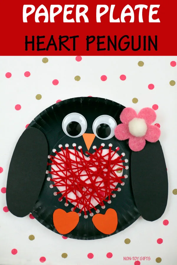 Paper plate heart penguin craft to make with kids on Valentine's Day. Cute winter craft with yarn. #penguins #valentinesday #valentinecraft