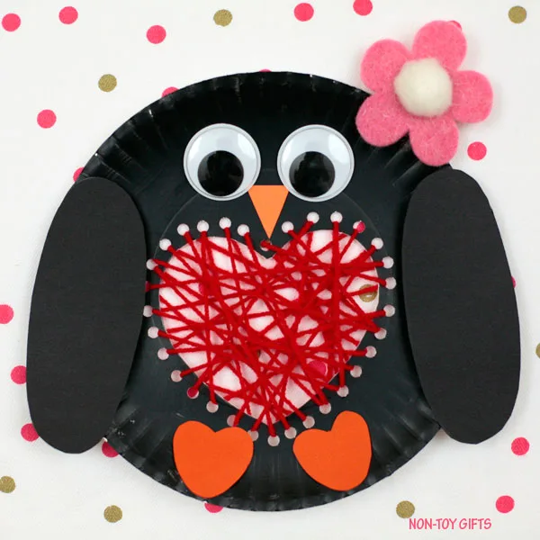 Paper plate penguin with a yarn heart