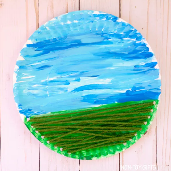 Yarn and paper plate flower craft for kids