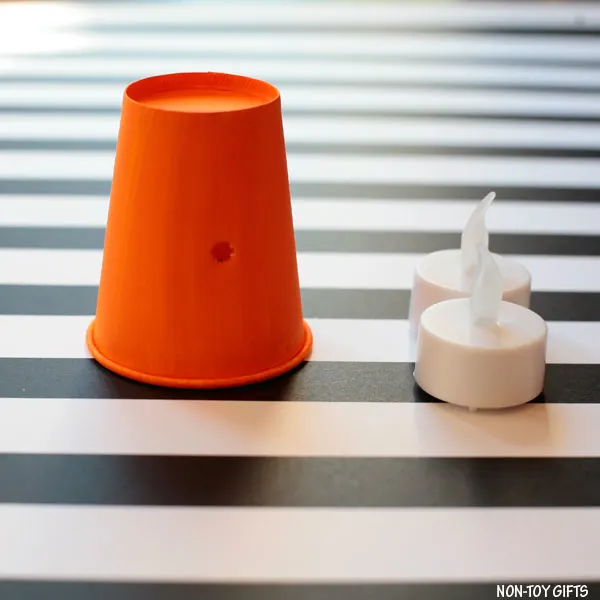 Paper cup with hole