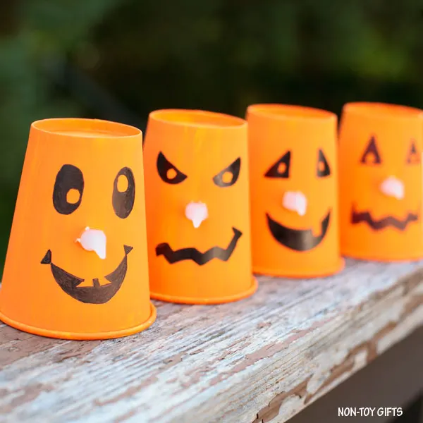Paper cup and light candle Jack'O'Lantern 