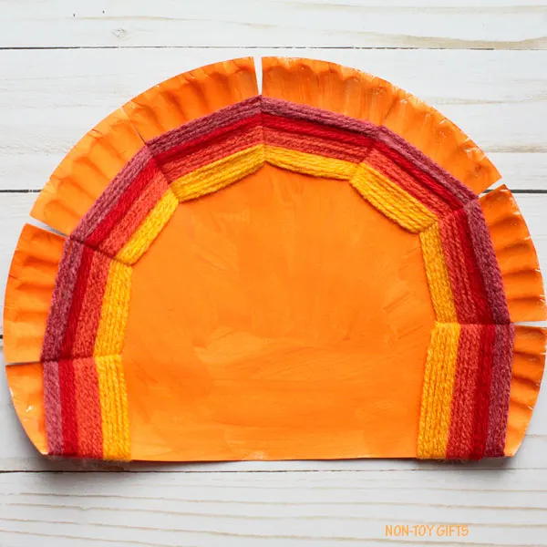 Paper plate and yarn tail