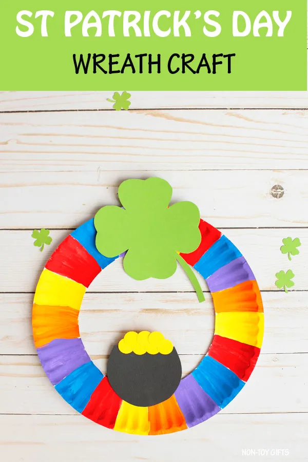 St Patrick's Day wreath craft for kids. Paper plate rainbow, shamrock and pot of gold craft. #nontoygifts #paperplate #stpatricksday #wreath
