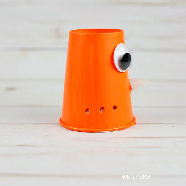 Pokes at the bottom of the cup