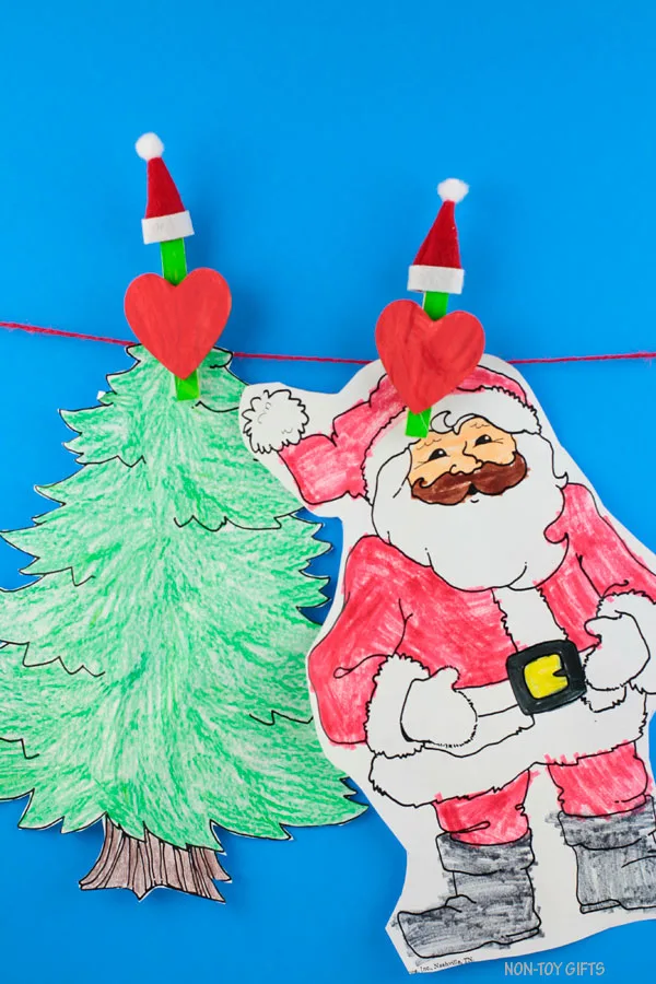 Kids artwork display made easy with these easy DIY Grinch clothespins. Christmas art display.