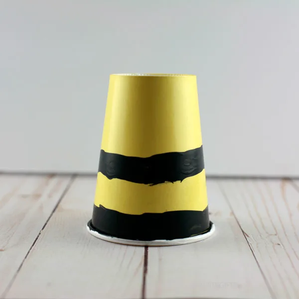 yellow cup with black stripes