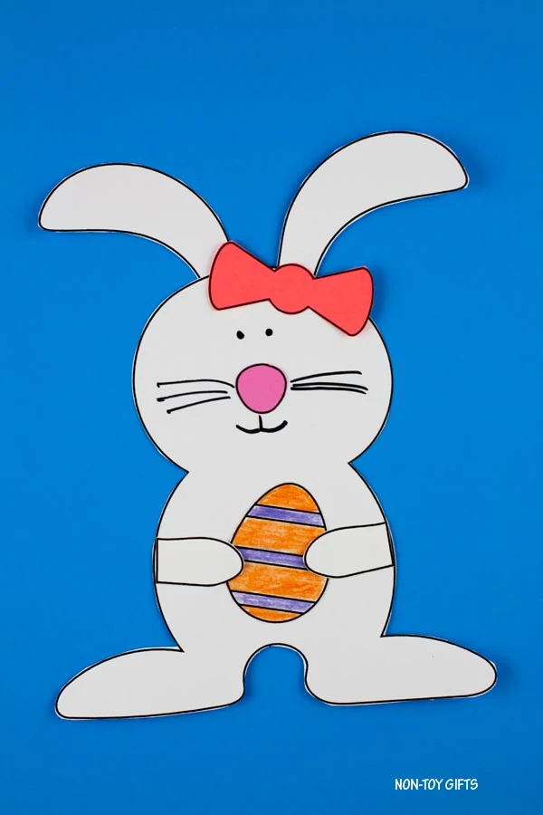 Easter bunny holding egg