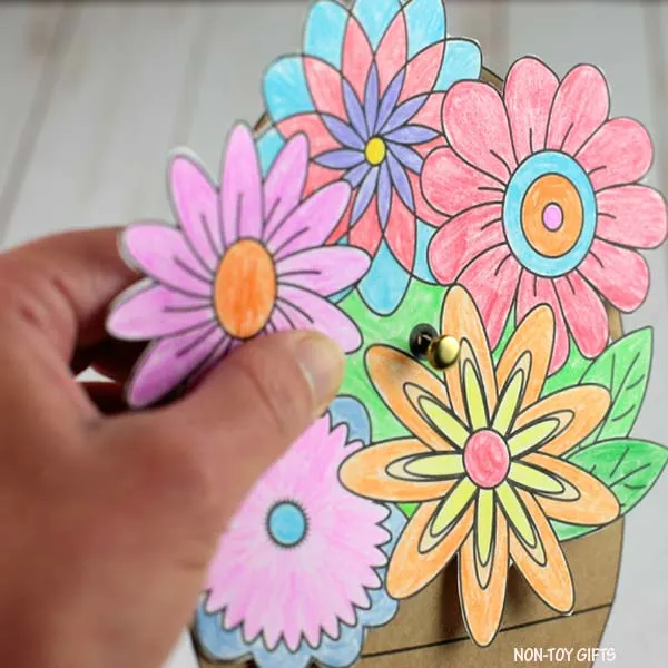 attach the flowers and bouquet paper together