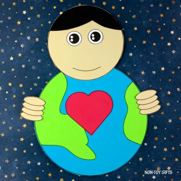 boy holding our Earth craft