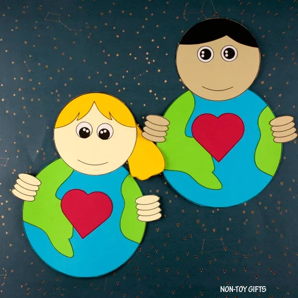 boy and girl holding our Earth craft