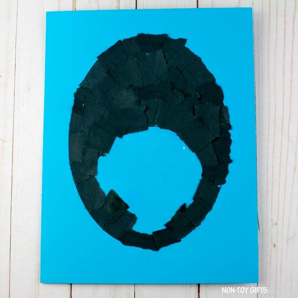 torn black paper