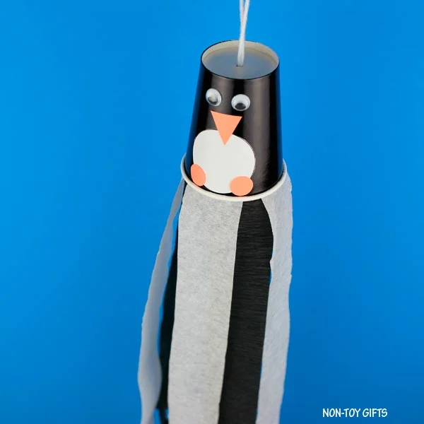 Paper cup penguin windsocks winter craft for kids