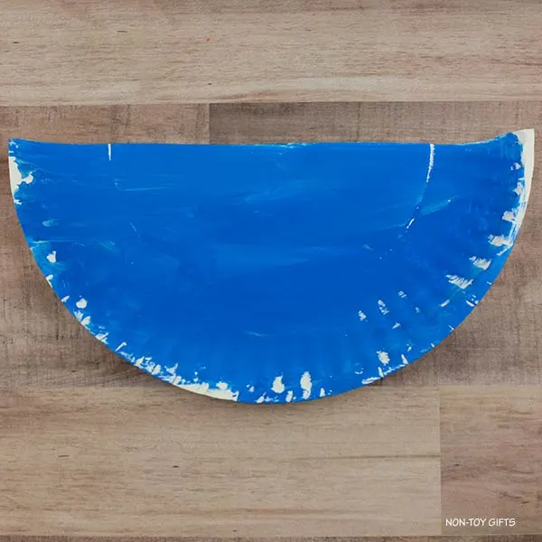 half paper plate painted blue