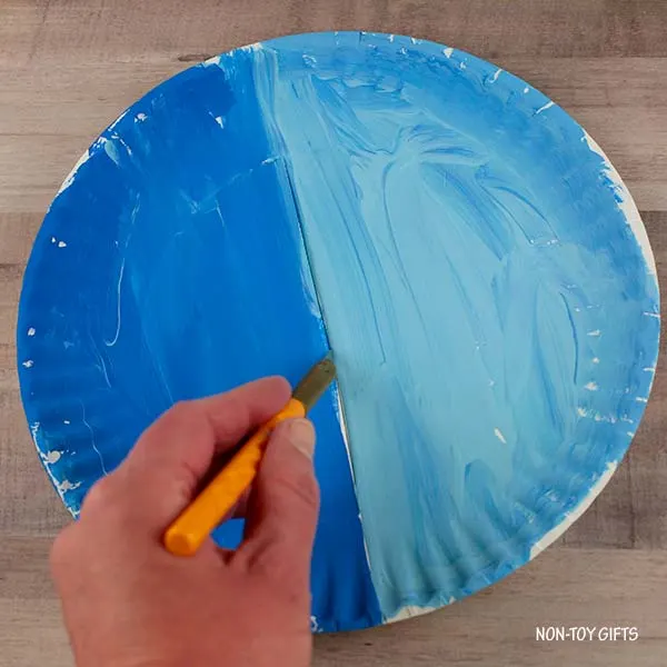 cut a slit in the middle of the paper plate