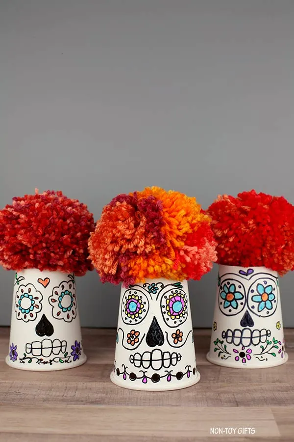 pom pom and paper cup sugar skull craft for kids