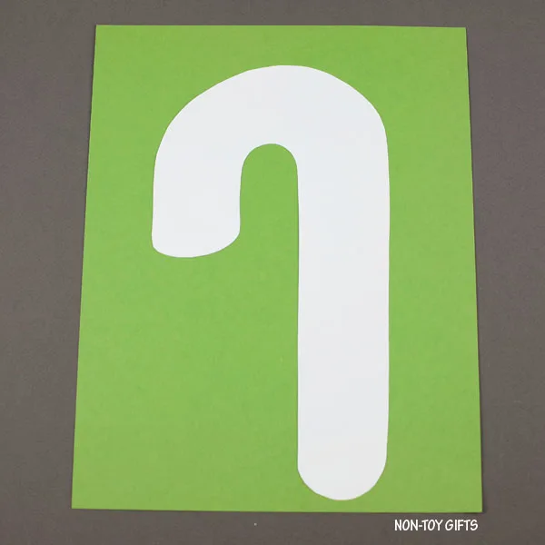 glue the white cane on green paper