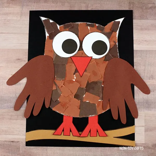 glue owl onto the black paper