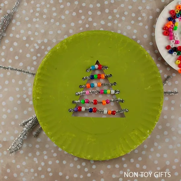 slide plastic beads through pipe cleaners