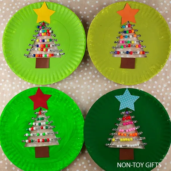 add star at the top of the trees and trunk at the bottom