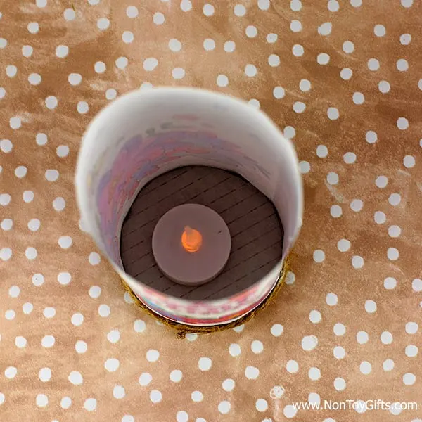 Slide in a flameless tea light candle