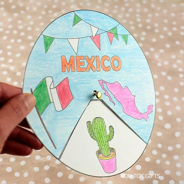 Attach the wheel and cover together with a paper fastener.
