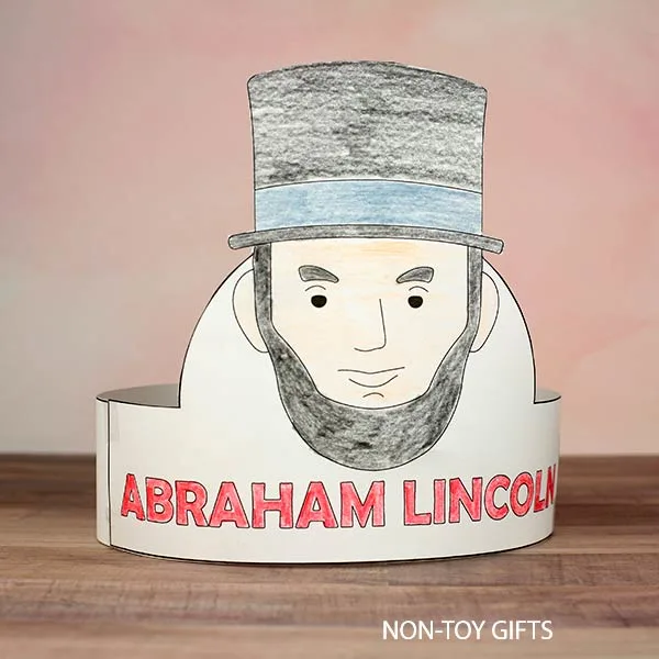 Kids assembling an Abraham Lincoln paper hat for Presidents Day