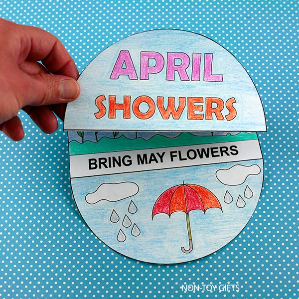Preschool spring craft printable with umbrella, raindrops, rainbow, and blooming flowers coloring activity
