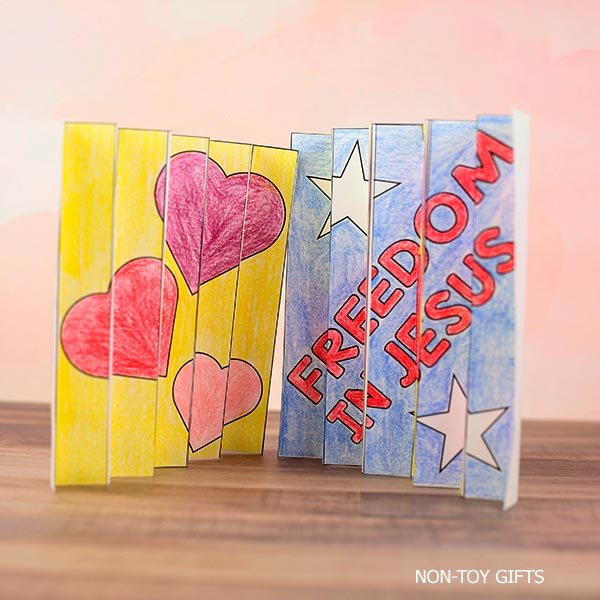 Patriotic Christian craft printable with God Bless America and Freedom in Jesus agamograph designs for kids church, VBS, and classroom activities.